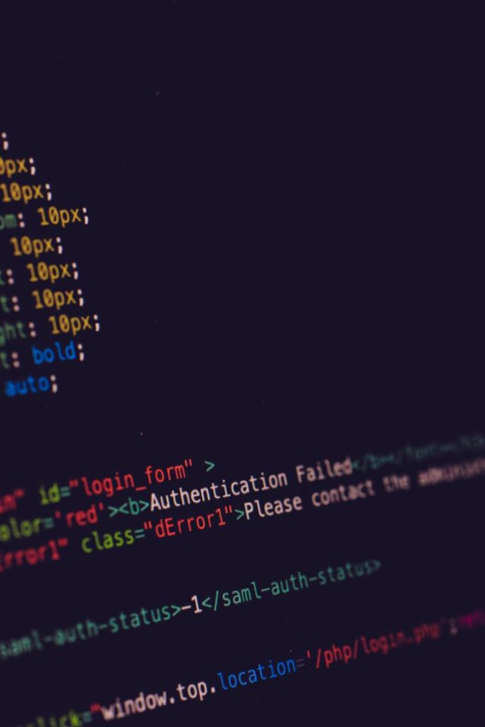 Overcoming Challenges Lessons Every Entrepreneur Must Learn Close-up of programming code on a dark screen, highlighting software development concepts.