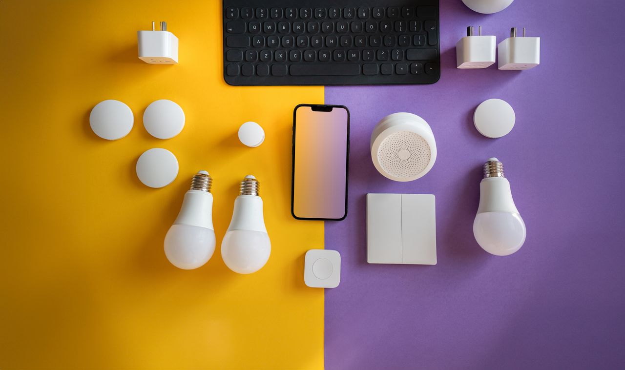 experience-img Flat lay of electronics, smart home gadgets on a colorful background for tech concepts.